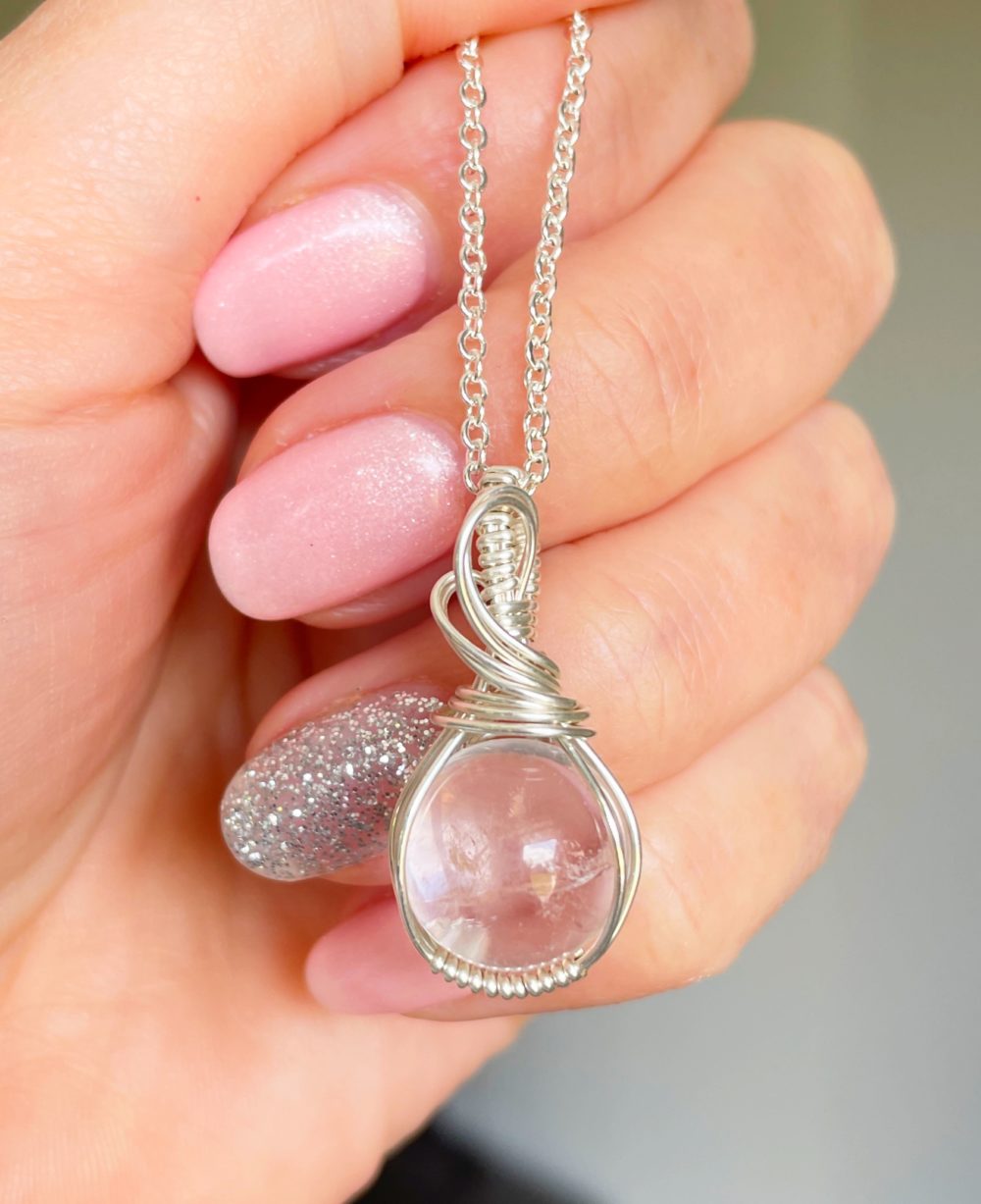 Clear Quartz sphere wrapped in silver pendant