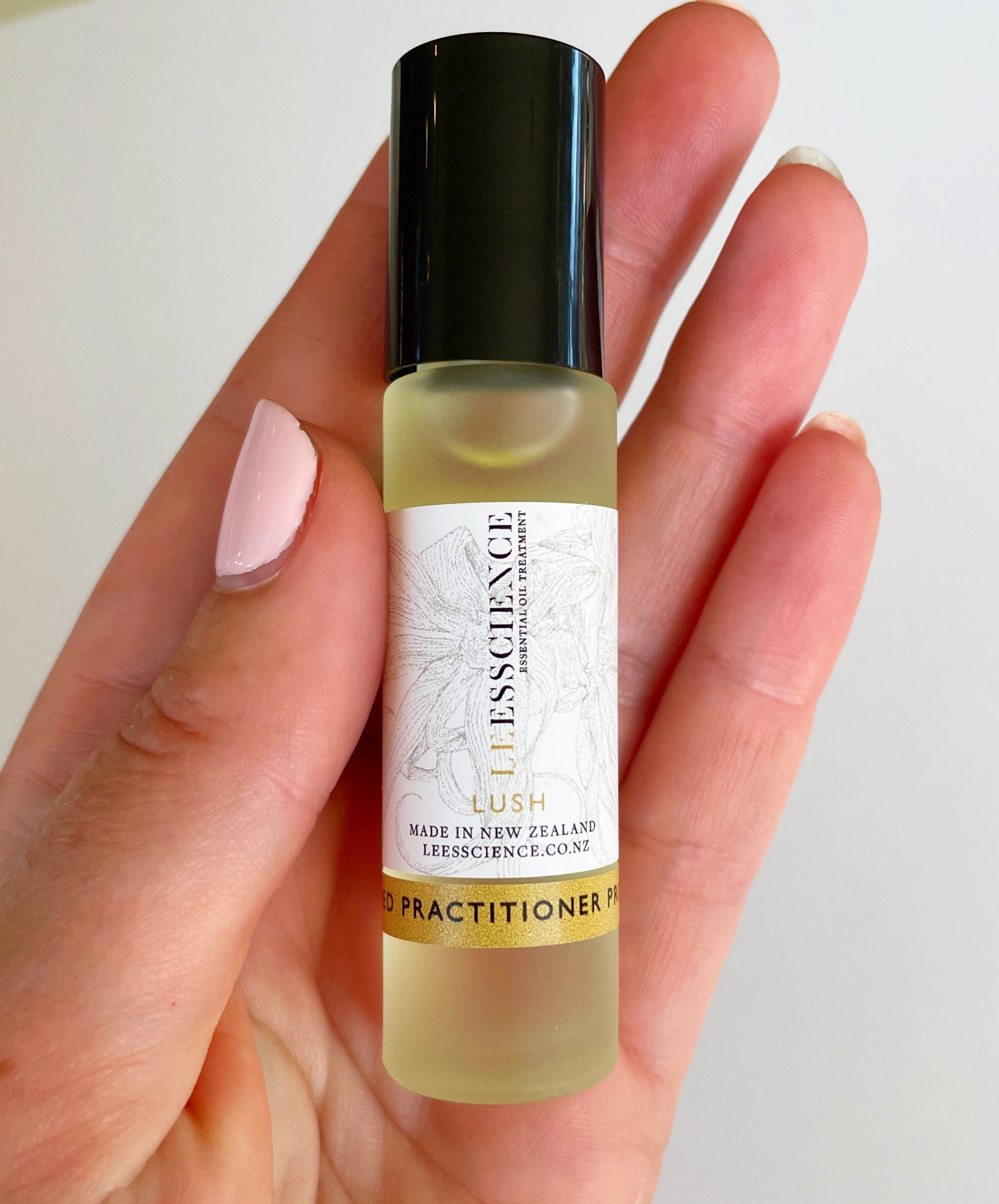 Lush essential oil roller bottle, uplifting essential oil blend